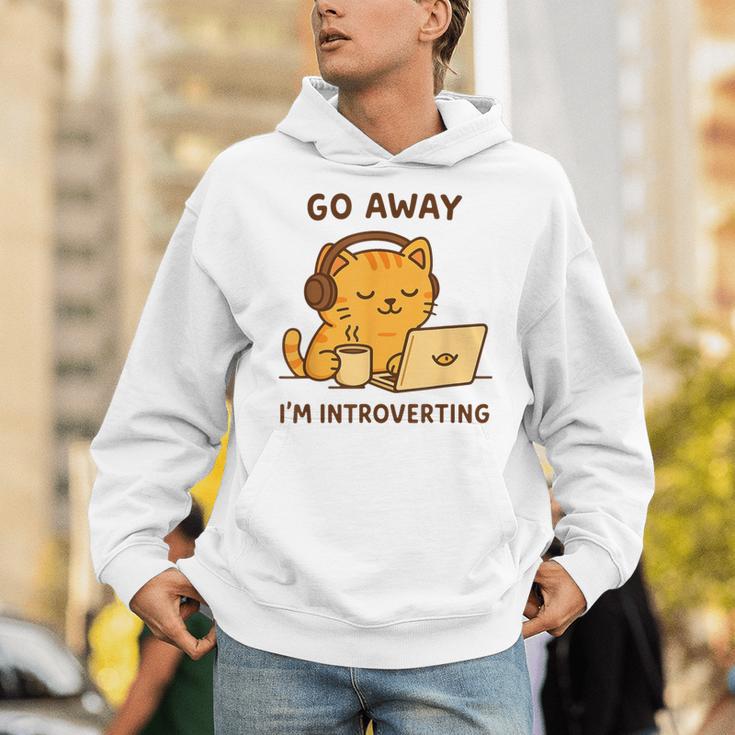 Go Away I'm Introverting Cozy Cat With Laptop And Coffee Unisex Hoodie Go Away I'm Introverting Cozy Cat With Laptop And Coffee Unisex Hoodie