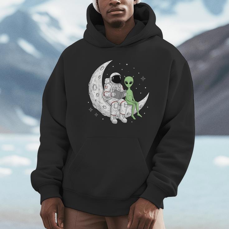 Astronaut Reading Book To Alien Moon Space Book Lover Men Unisex Hoodie
