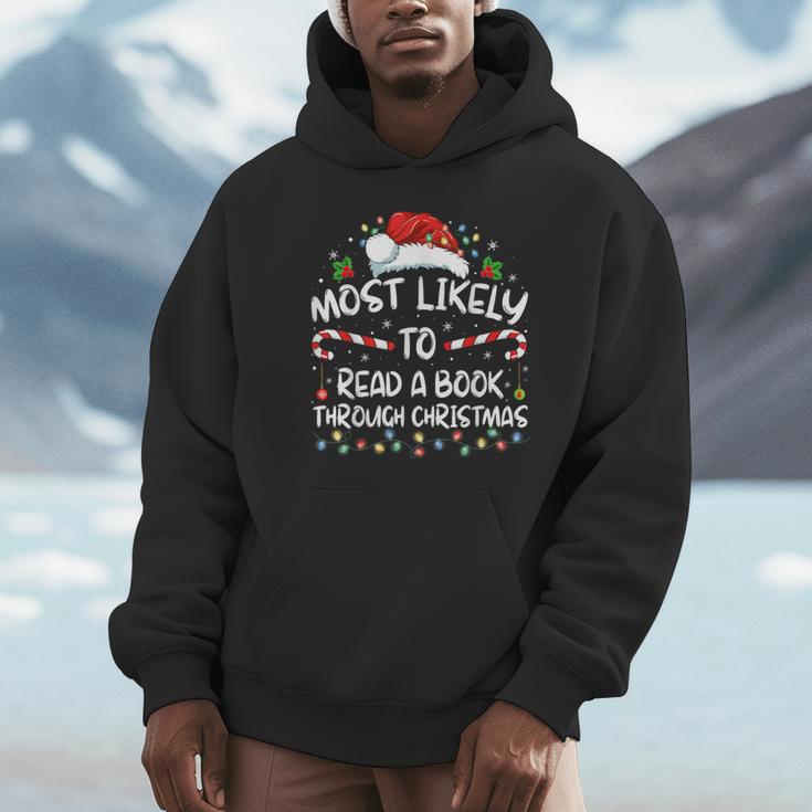 Most Likely To Read A Book Through Christmas Xmas Unisex Hoodie Most Likely To Read A Book Through Christmas Xmas Unisex Hoodie