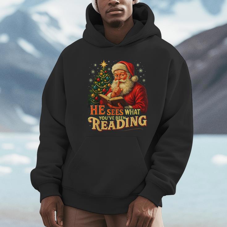 He Sees What You’Ve Been Reading Santa Book Lover Christmas Unisex Hoodie
