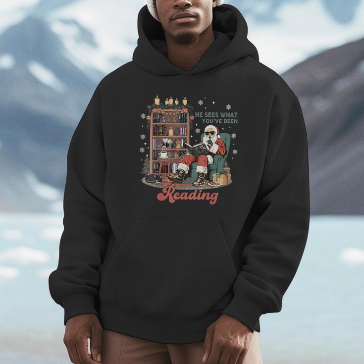 He Sees What You'Ve Been Reading Santa Christmas Bookish Unisex Hoodie He Sees What You'Ve Been Reading Santa Christmas Bookish Unisex Hoodie