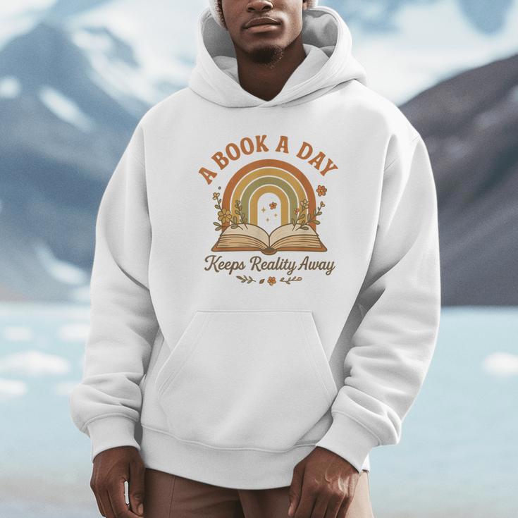 A Book A Day Keeps Reality Away Reading Unisex Hoodie A Book A Day Keeps Reality Away Reading Unisex Hoodie