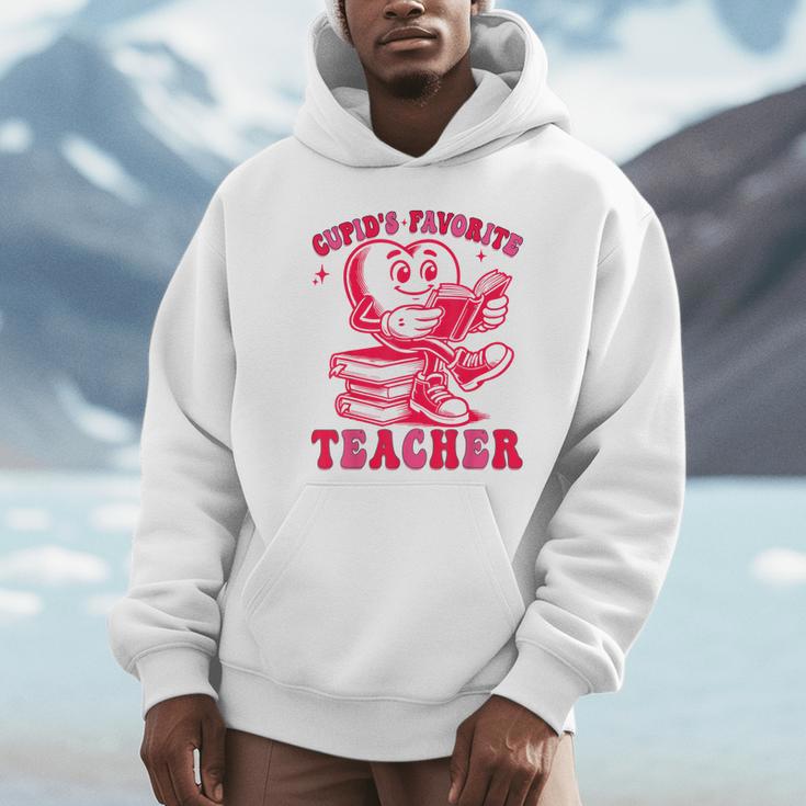 Cupid's Favorite Teacher Valentines Day Heart Book Lover Unisex Hoodie Cupid's Favorite Teacher Valentines Day Heart Book Lover Unisex Hoodie