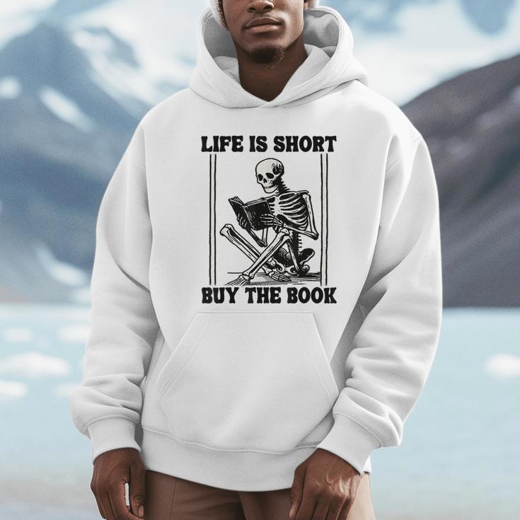 Life Is Short Buy The Book Skeleton Book Lover Reading Unisex Hoodie Life Is Short Buy The Book Skeleton Book Lover Reading Unisex Hoodie