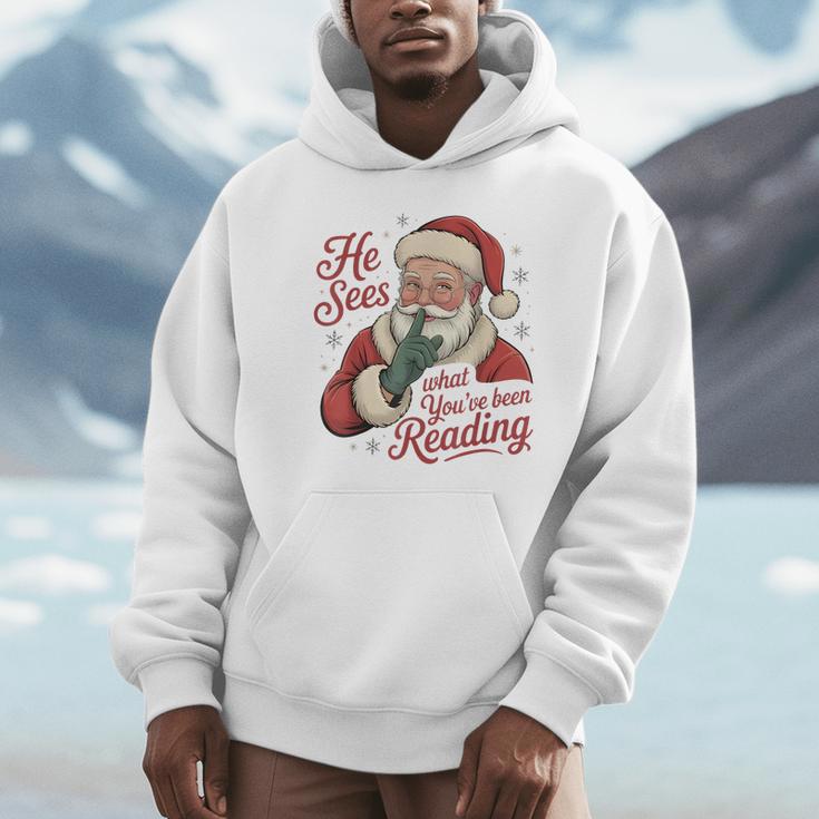 He Sees What You'Ve Been Reading Bookish Christmas Humor Unisex Hoodie He Sees What You'Ve Been Reading Bookish Christmas Humor Unisex Hoodie