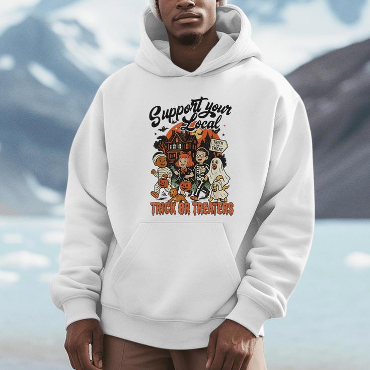 Support Your Local Trick Or Treaters Retro Spooky Nostalgia Unisex Hoodie Support Your Local Trick Or Treaters Retro Spooky Nostalgia Unisex Hoodie