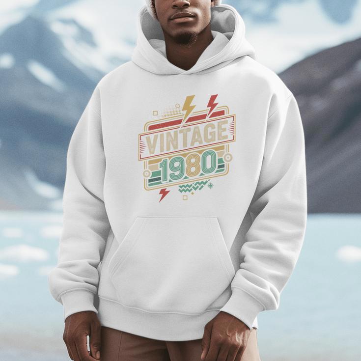 Vintage 1980 Retro Badge Decade Nostalgia Graphic Emblem Premium Tri-Blend Unisex Hoodie