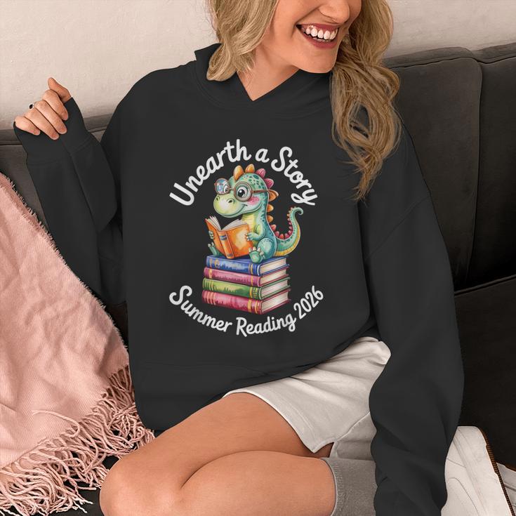 Unearth a Story Summer Reading 2026 Book Lover Dino Fun Unisex Hoodie Unearth a Story Summer Reading 2026 Book Lover Dino Fun Unisex Hoodie