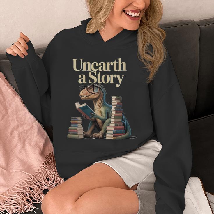 Women's Unearth A Story Dinosaur Reading a Library Book Unisex Hoodie