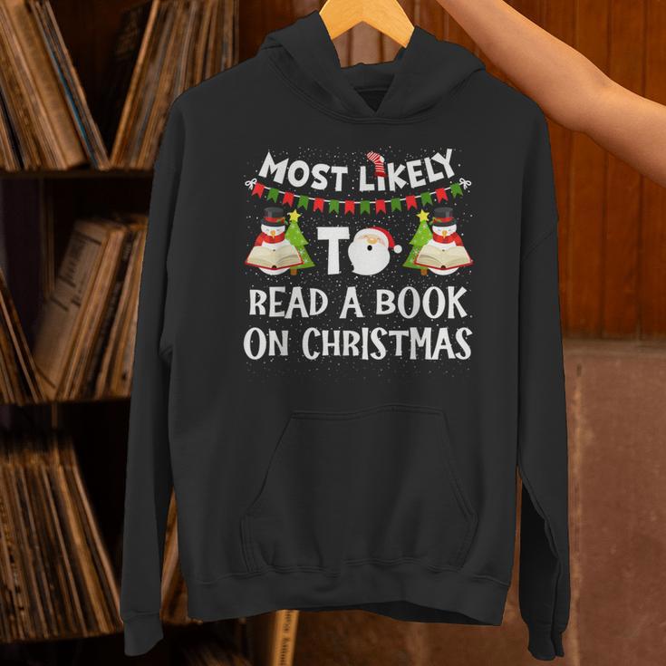 Most Likely To Read A Book On Christmas Snowman Family Unisex Hoodie