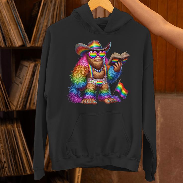 Rainbow Pride Bigfoot Reading Book With Heart Glasses Unisex Hoodie Rainbow Pride Bigfoot Reading Book With Heart Glasses Unisex Hoodie