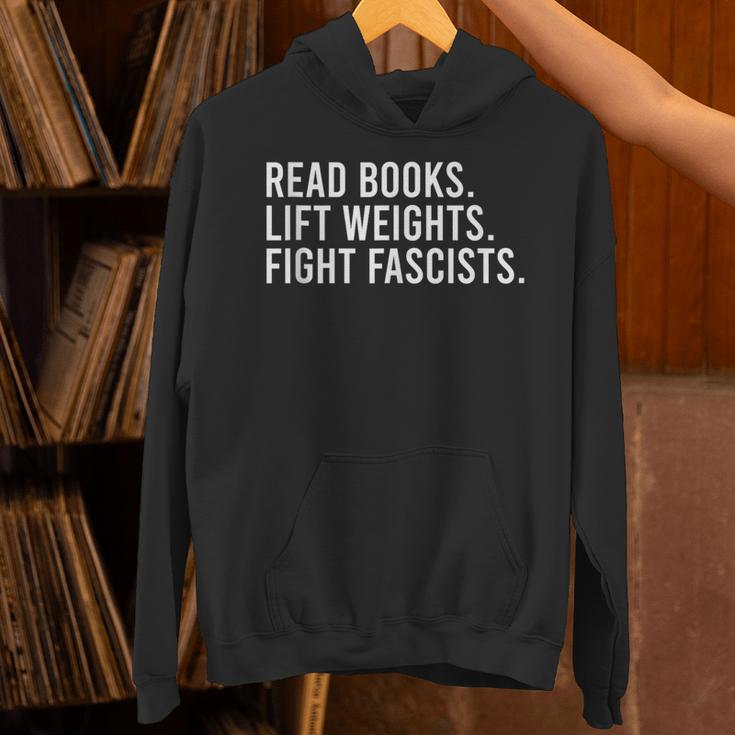 Read Books Lift Weights Fight Fascists Reading Activism Unisex Hoodie Read Books Lift Weights Fight Fascists Reading Activism Unisex Hoodie