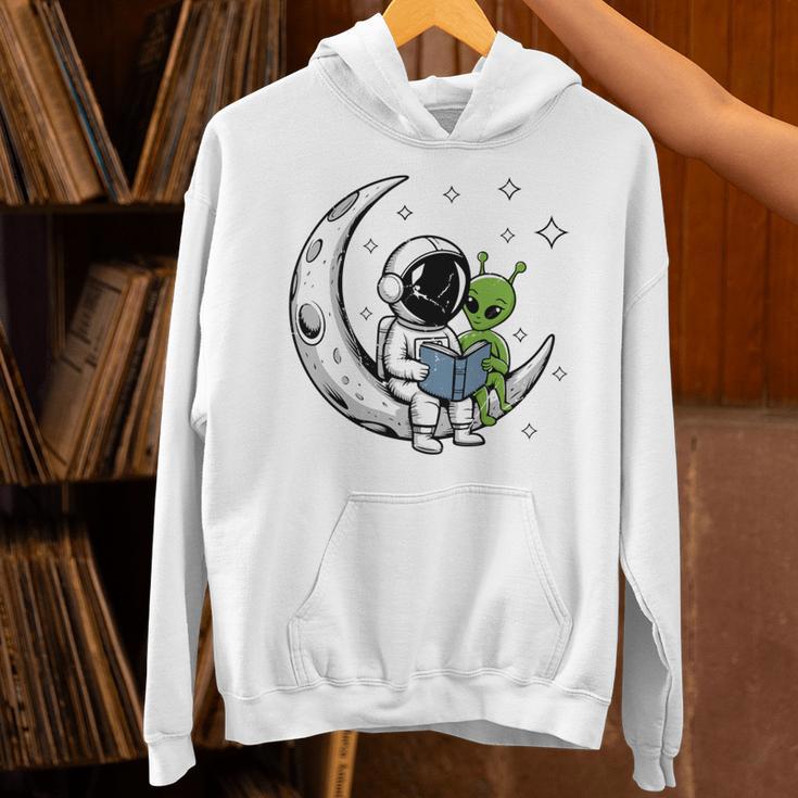 Astronaut Reading Book To Alien Moon Space Astronomy Unisex Hoodie