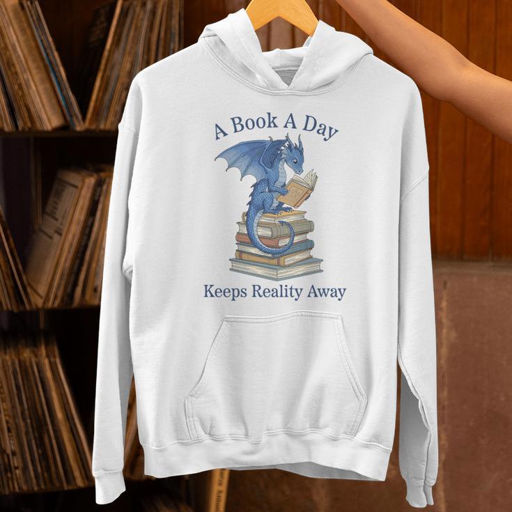 A Book A Day Keeps Reality Away Premium Tri-Blend Unisex Hoodie