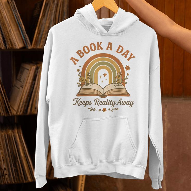 A Book A Day Keeps Reality Away Reading Unisex Hoodie A Book A Day Keeps Reality Away Reading Unisex Hoodie