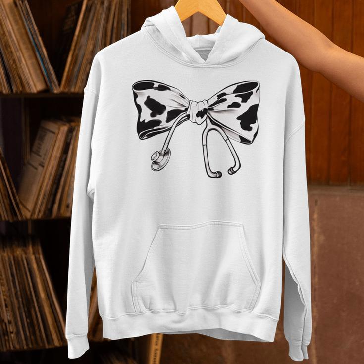 Cow Print Bow And Stethoscope Nurse RN Graduation Coquette Unisex Hoodie