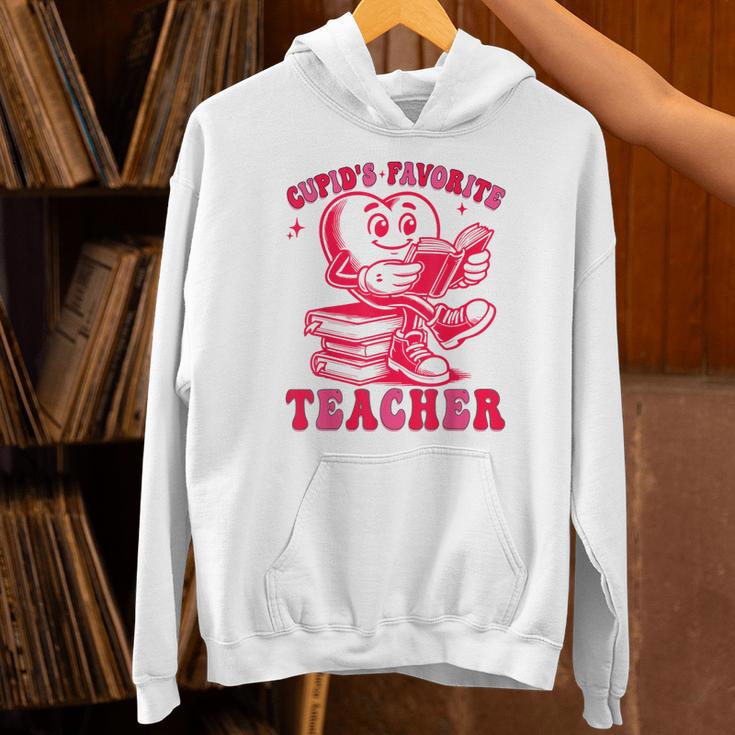 Cupid's Favorite Teacher Valentines Day Heart Book Lover Unisex Hoodie Cupid's Favorite Teacher Valentines Day Heart Book Lover Unisex Hoodie