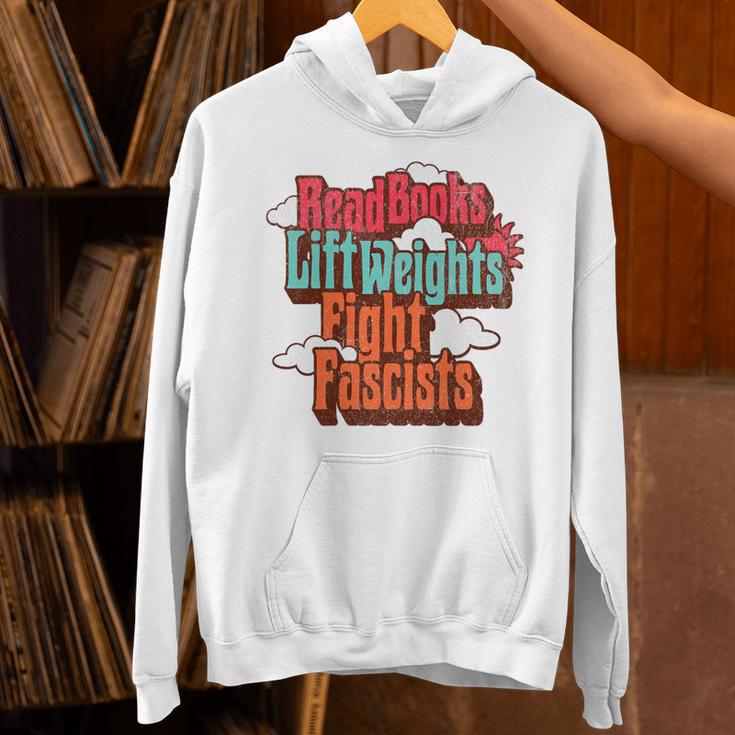 Read Books Lift Weights Fight Fascists Reading No Kings Premium Tri-Blend Unisex Hoodie
