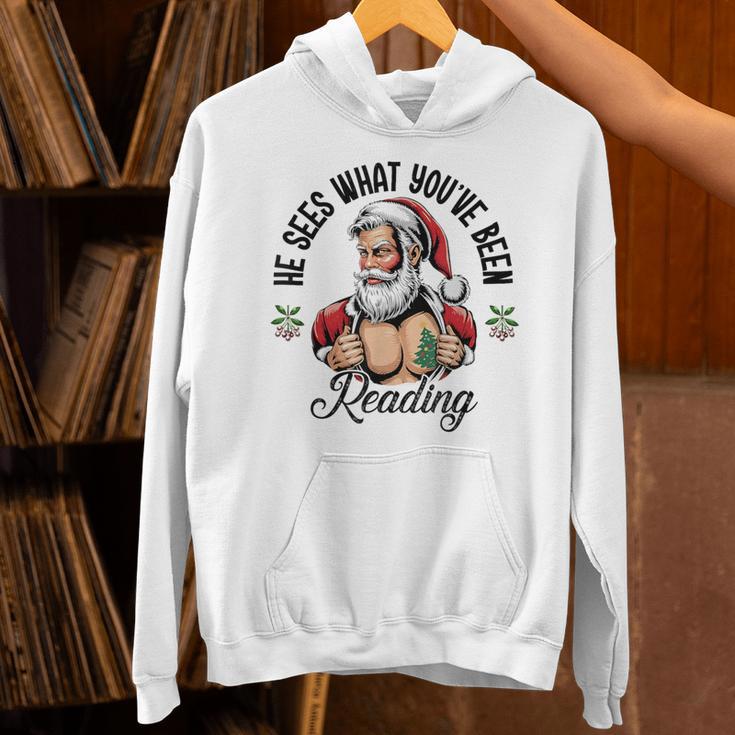 He Sees What You'Ve Been Reading Santa Xmas Book Lover Unisex Hoodie He Sees What You'Ve Been Reading Santa Xmas Book Lover Unisex Hoodie