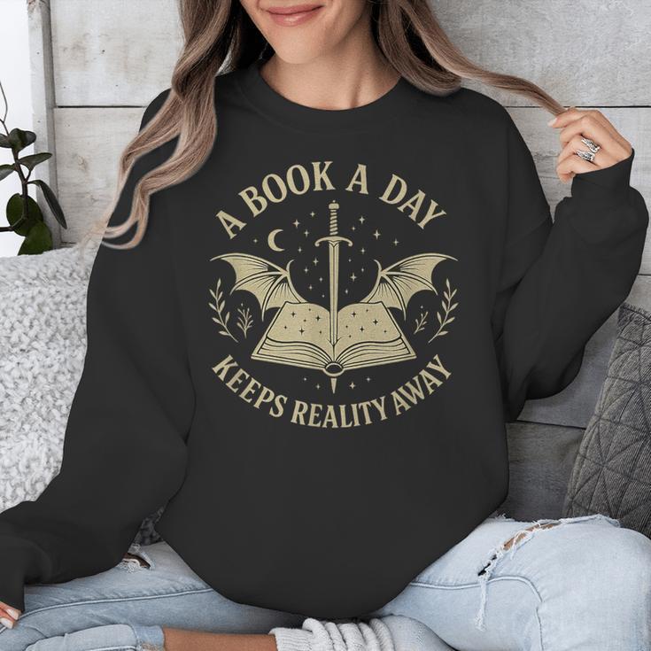 A Book A Day Keeps Reality Away Reading Escape Quote Unisex Sweatshirt