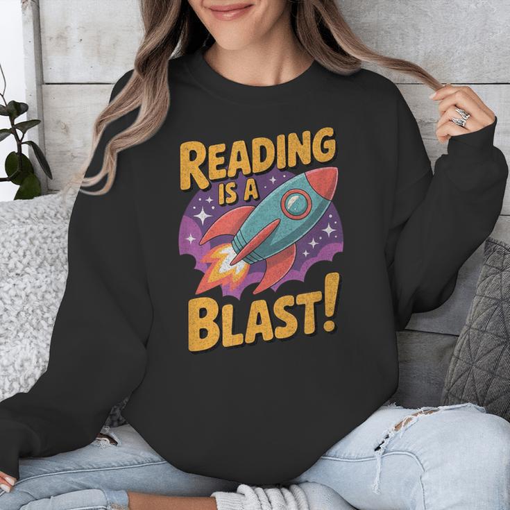 Book Lover Kids And Adults Reading Is a Blast Rocket Ship Unisex Sweatshirt