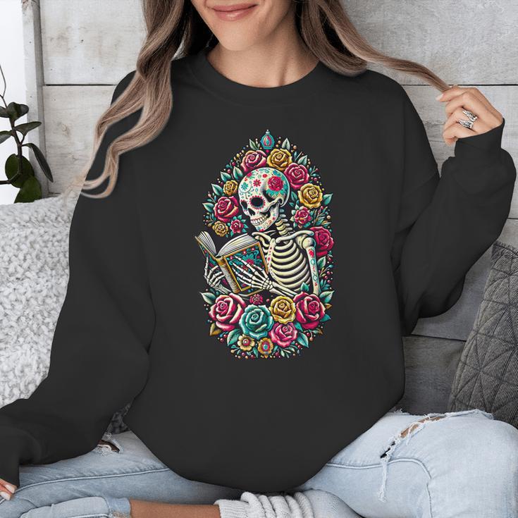 Book Lover Skeleton Reading With Dia De Los Muertos Flowers Unisex Sweatshirt Book Lover Skeleton Reading With Dia De Los Muertos Flowers Unisex Sweatshirt