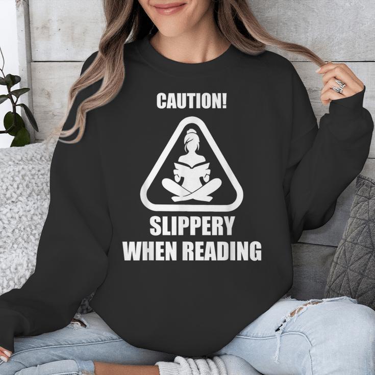 Caution Slippery When Reading Book Lover Unisex Sweatshirt