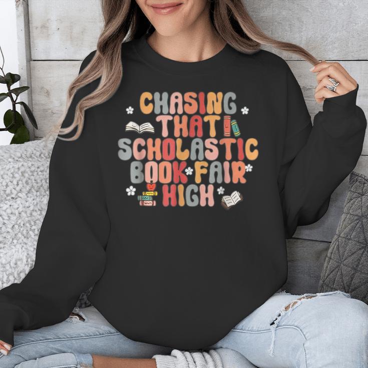 CHASING THAT SCHOLASTIC BOOK FAIR HIGH Unisex Sweatshirt