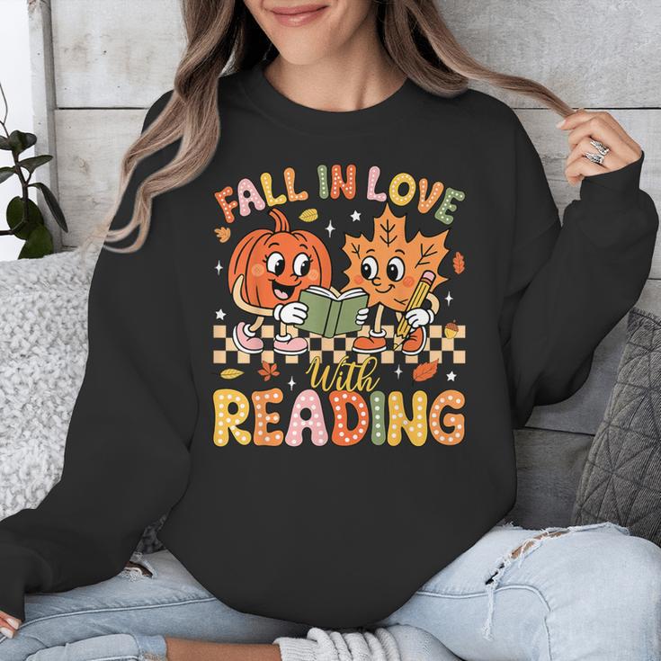 Fall In Love With Reading Autumn Pumpkin Teacher Book Lover Unisex Sweatshirt