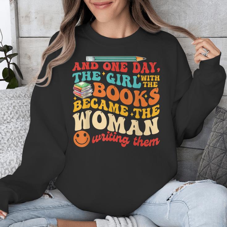 The Girl With The Books Became The Woman Writing Them Unisex Sweatshirt