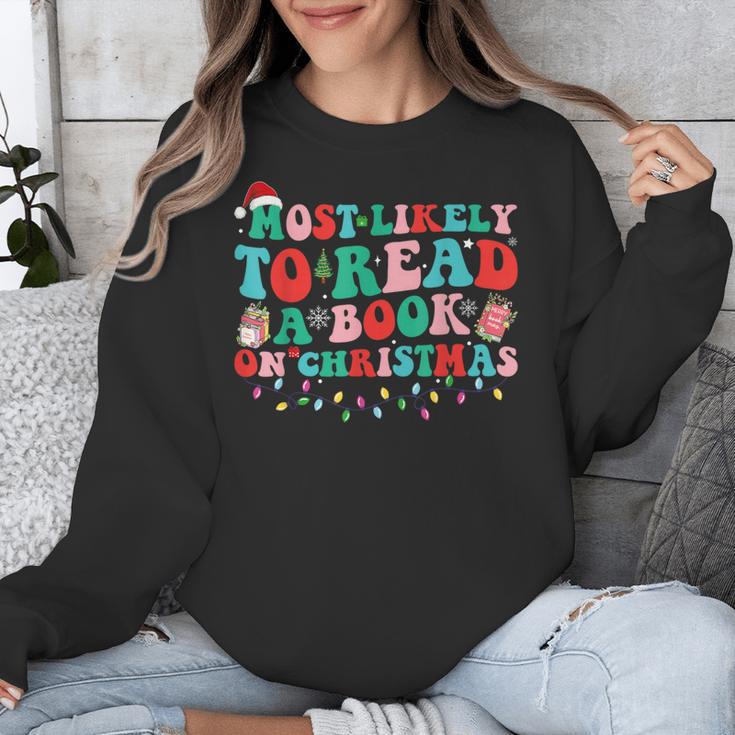 Groovy Christmas Most Likely To Read A Book On Christmas Unisex Sweatshirt