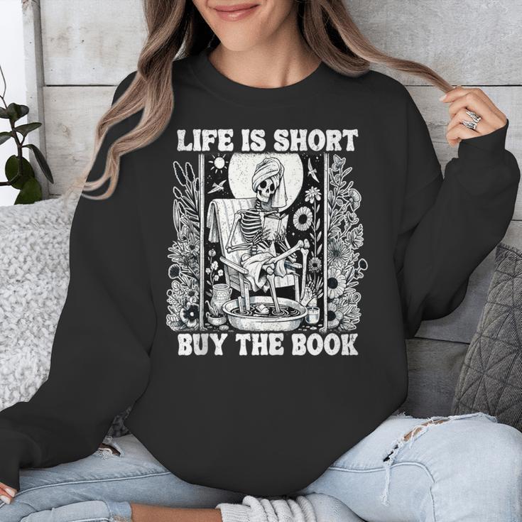 Life Is Short Buy The Book Introvert Skeleton Reading Unisex Sweatshirt Life Is Short Buy The Book Introvert Skeleton Reading Unisex Sweatshirt