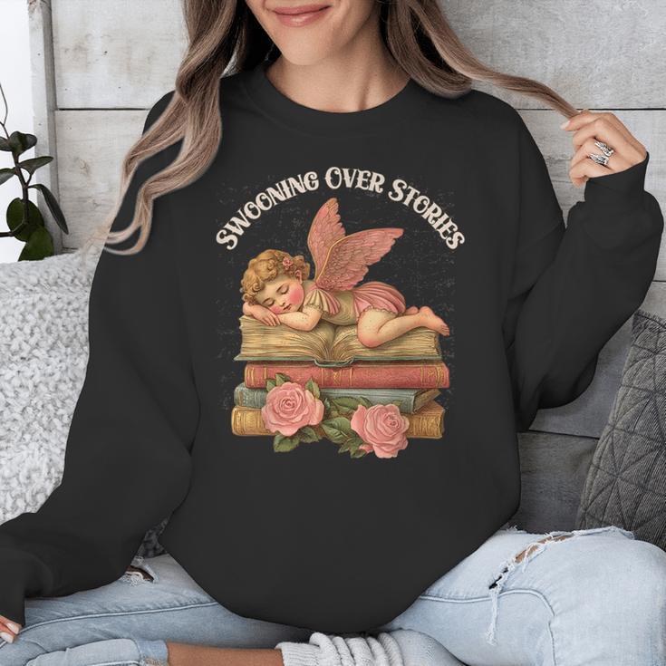 Valentine's Swooning Over Stories Cupid And Book Lover Tee Unisex Sweatshirt
