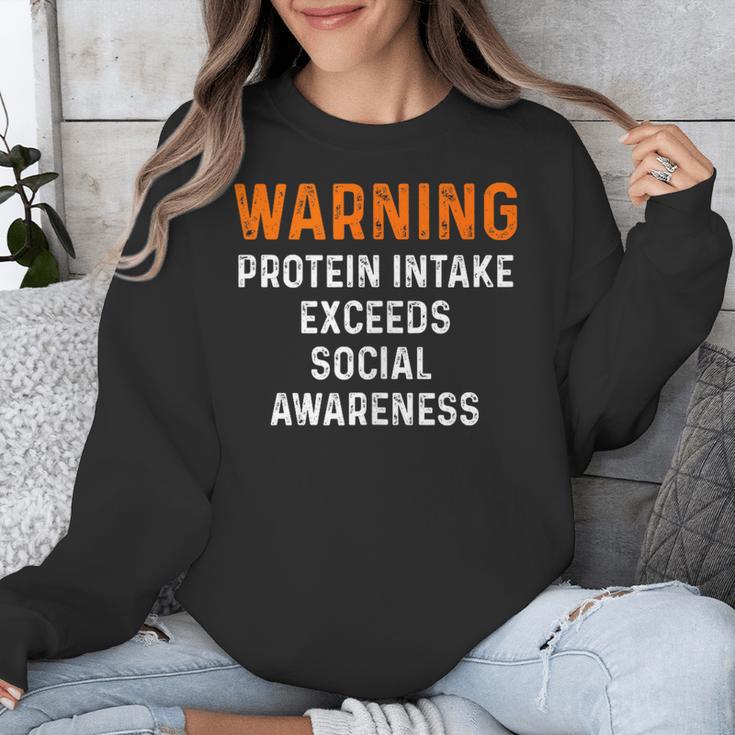 Warning Protein Intake Exceeds Social Awareness Introvert Unisex Sweatshirt Warning Protein Intake Exceeds Social Awareness Introvert Unisex Sweatshirt