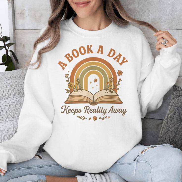 A Book A Day Keeps Reality Away Reading Unisex Sweatshirt A Book A Day Keeps Reality Away Reading Unisex Sweatshirt