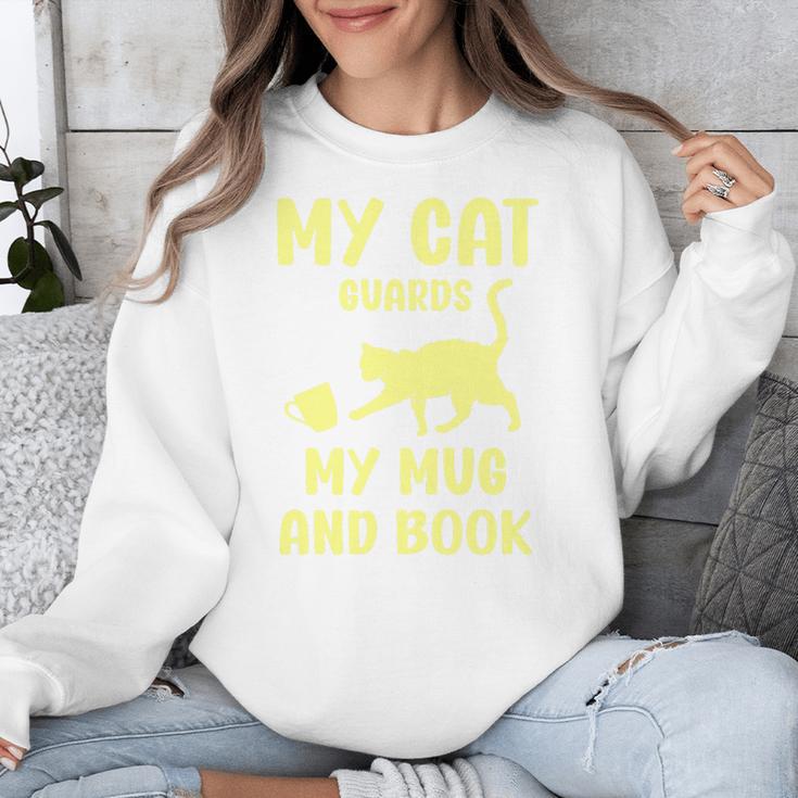 My Cat Guards My Mug And Book Humor Cats Premium Tri-Blend Unisex Sweatshirt