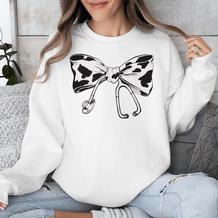 Cow Print Bow And Stethoscope Nurse RN Graduation Coquette Unisex Sweatshirt