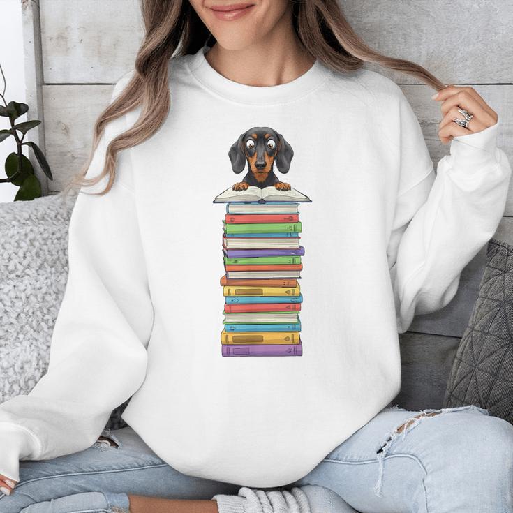 Cute Wiener Dog Dachshund Reading On Pile Of Books Unisex Sweatshirt Cute Wiener Dog Dachshund Reading On Pile Of Books Unisex Sweatshirt