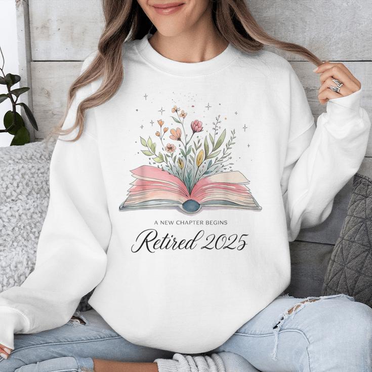 Quote New Chapter Begins Retired 2025 Floral Open Book Unisex Sweatshirt Quote New Chapter Begins Retired 2025 Floral Open Book Unisex Sweatshirt