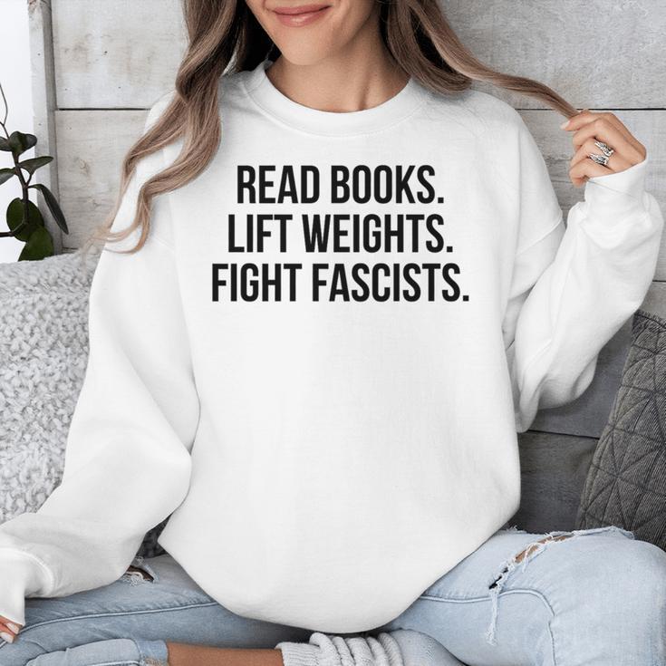 Read Books Lift Weights Fight Fascists Premium Tri-Blend Unisex Sweatshirt Read Books Lift Weights Fight Fascists Premium Tri-Blend Unisex Sweatshirt