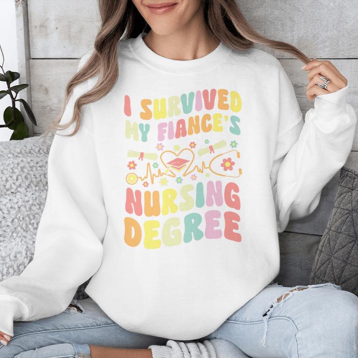 i Survived My Fiance's Nursing Degree Graduation Groovy Premium Unisex Sweatshirt