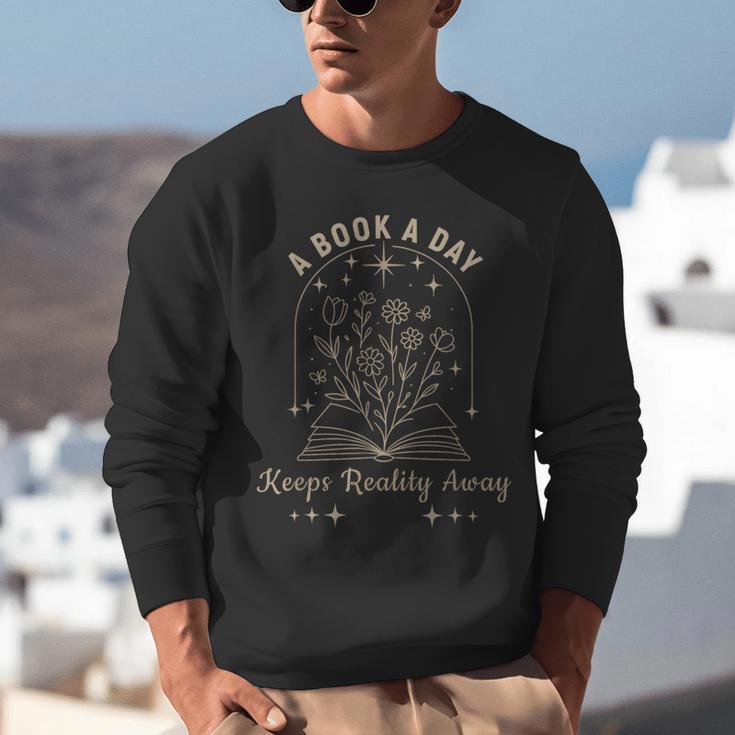 A Book A Day Keeps Reality Away Unisex Sweatshirt