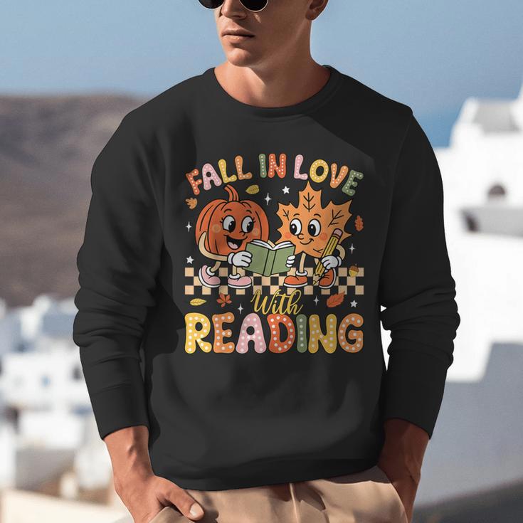 Fall In Love With Reading Autumn Pumpkin Teacher Book Lover Unisex Sweatshirt