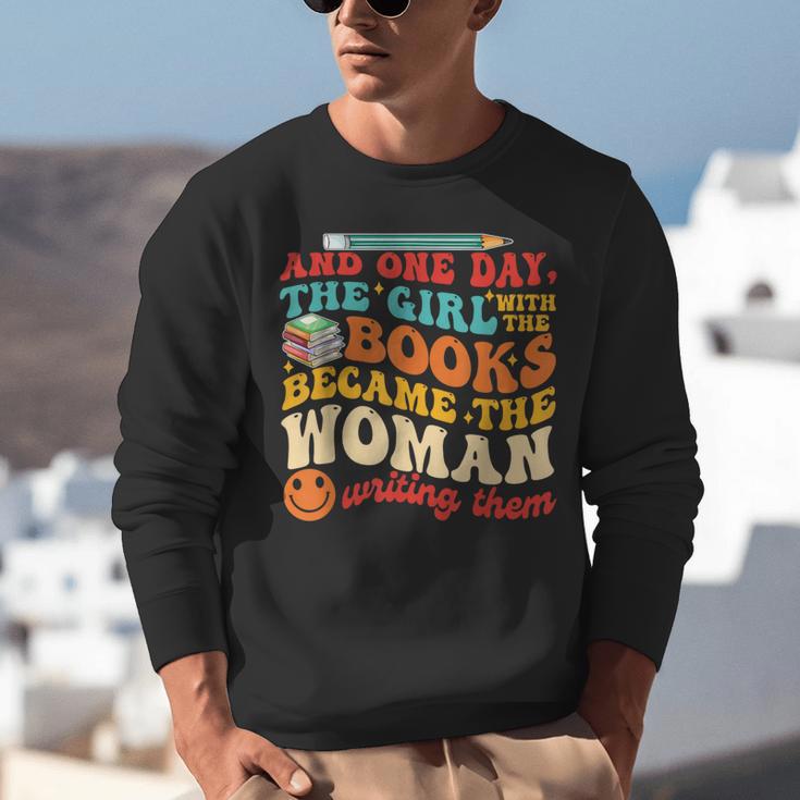 The Girl With The Books Became The Woman Writing Them Unisex Sweatshirt