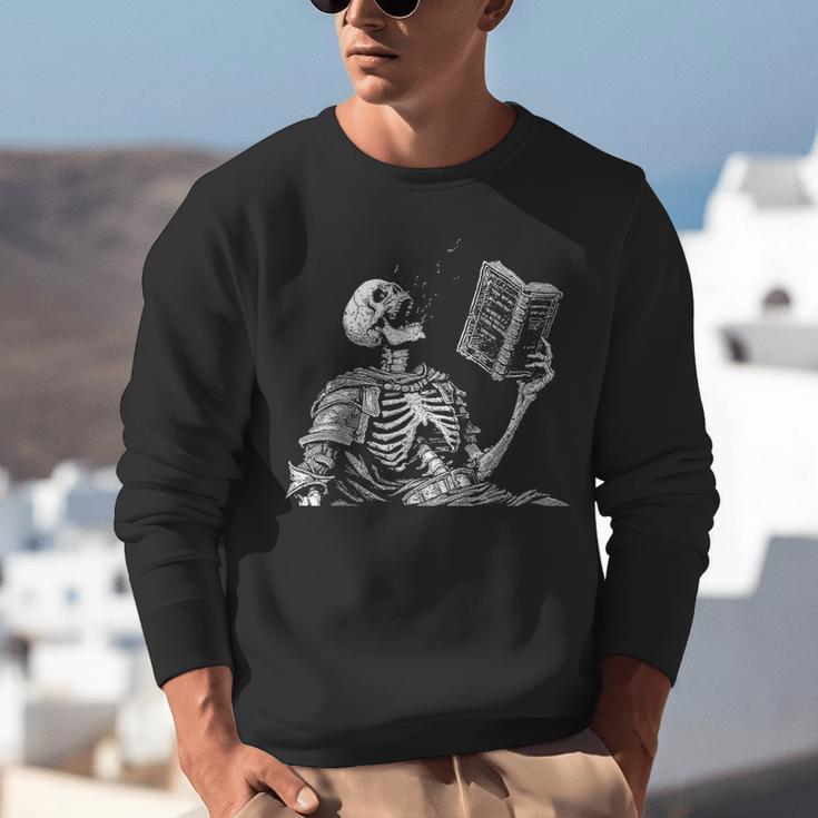Hilarious Skeleton Holding a Book And Laughing Gothic Unisex Sweatshirt