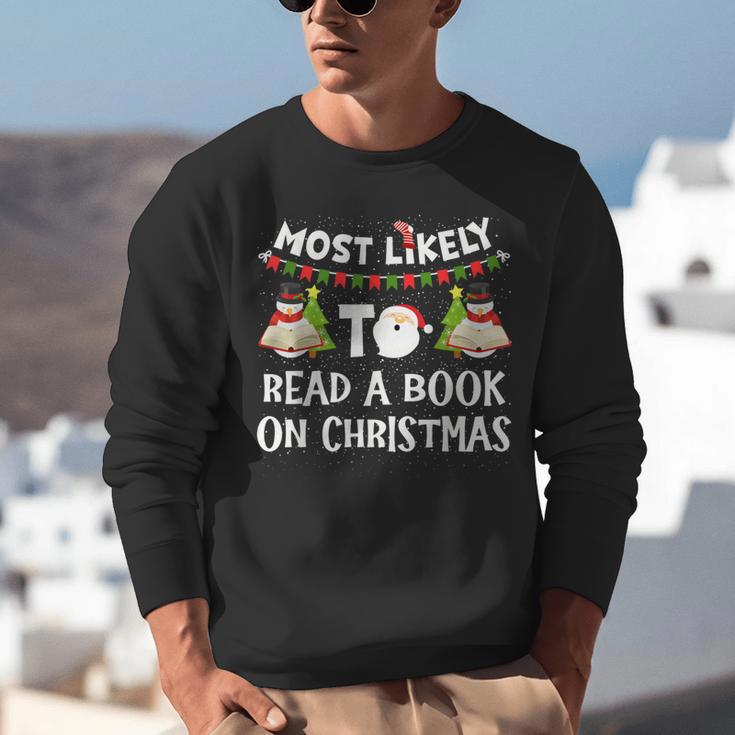 Most Likely To Read A Book On Christmas Snowman Family Unisex Sweatshirt