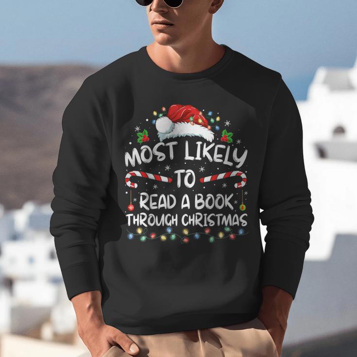Most Likely To Read A Book Through Christmas Xmas Unisex Sweatshirt Most Likely To Read A Book Through Christmas Xmas Unisex Sweatshirt