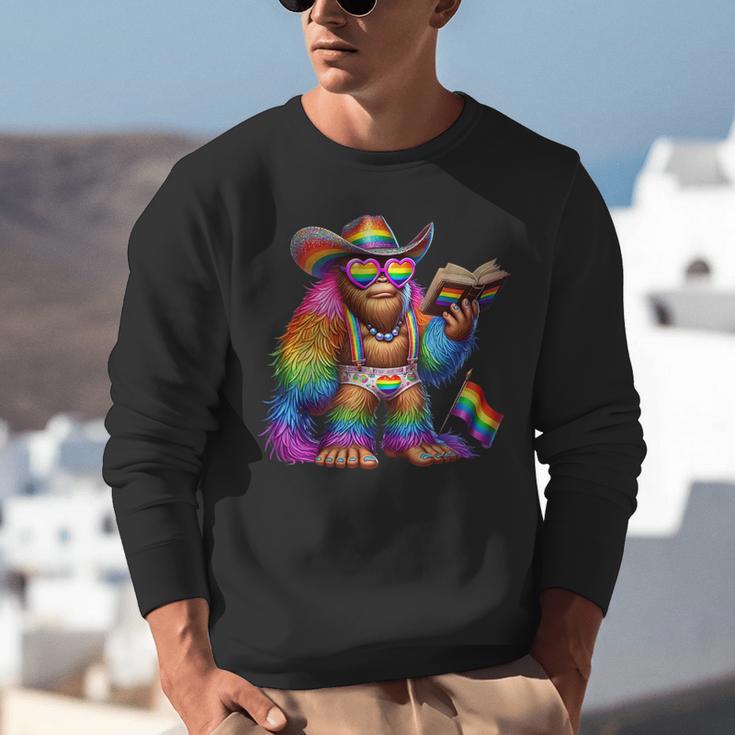 Rainbow Pride Bigfoot Reading Book With Heart Glasses Unisex Sweatshirt