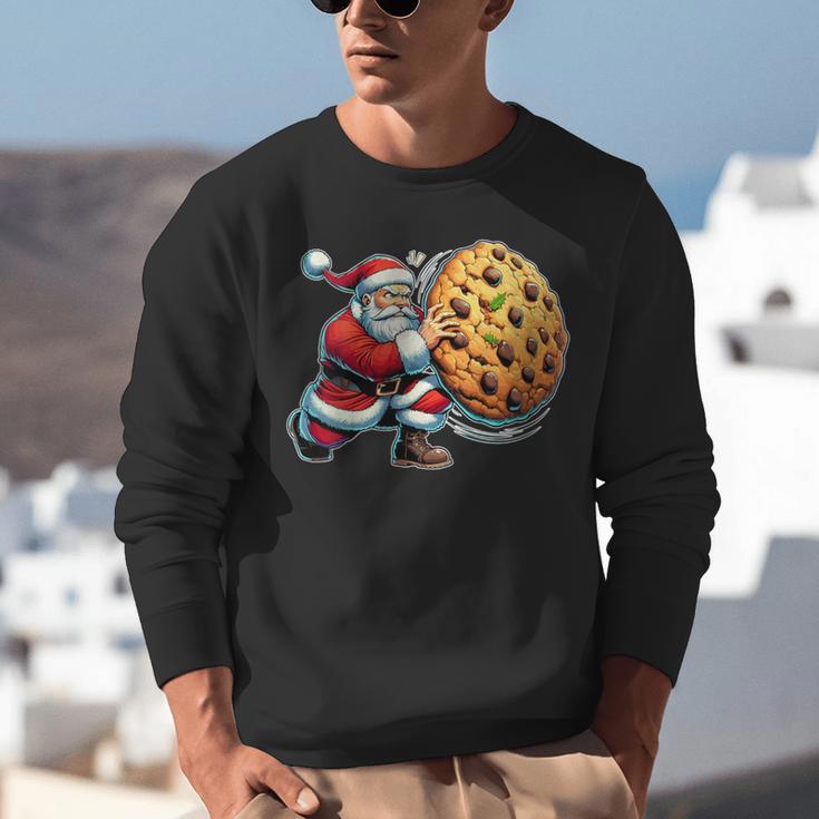 Santa Holding Cookie Xmas Baker Introvert Christmas Unisex Sweatshirt Santa Holding Cookie Xmas Baker Introvert Christmas Unisex Sweatshirt