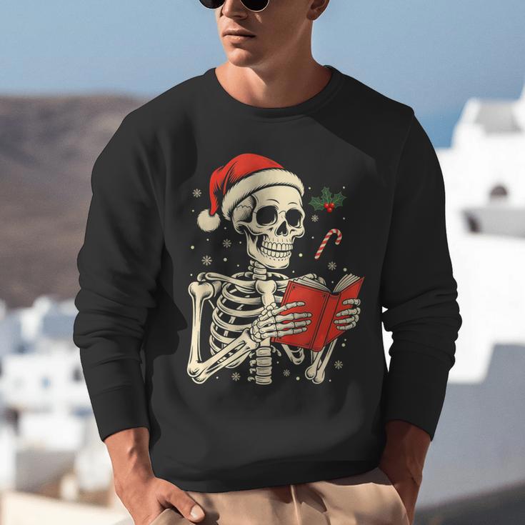 Skeleton Reading Book Christmas Teacher Librarian Book Lover Unisex Sweatshirt